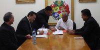 Members of Maori Trust and Prime Minister &#039;Akilisi Pohiva and Minister of Public Enterprise Poasi Tei signing agreement to takeover Tonga Forests Products