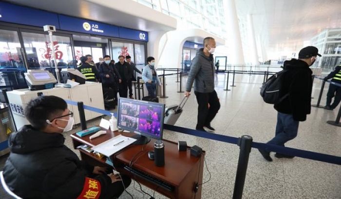 Staff members take passengers&#039; body temperature at Tianhe International Airport in Wuhan, capital of central China&#039;s Hubei Province Photo: AFP