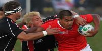 Sione Vaiomo&#039;unga carries the ball for Tonga during pool game with Canada in the 2011 Rugby World Cup in New Zealand